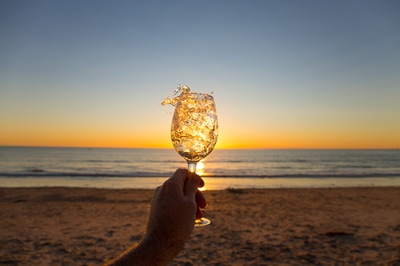 Wine splash at sunset in Glenelg beach, Adelaide, South Australia